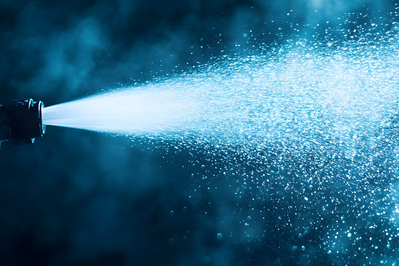 Hydro Jetting nozzle shooting water spray for cleaning drain lines